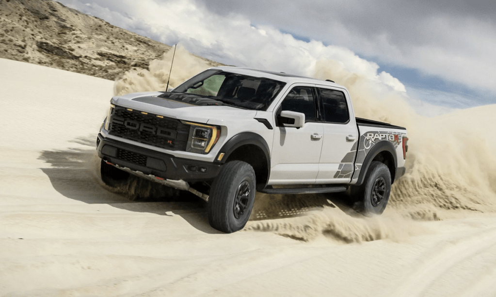 The 2023 Ford F-150 Raptor R kicking up sand