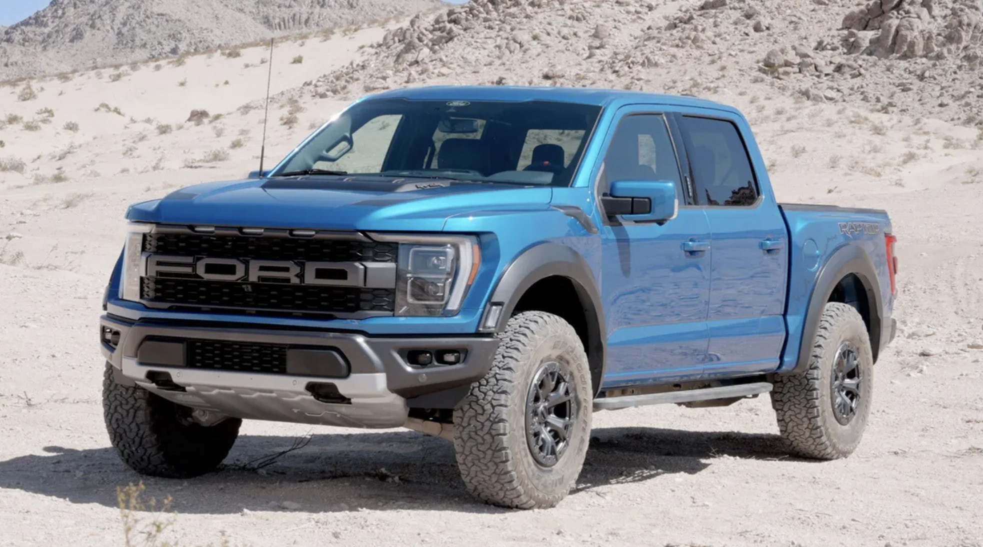 The 2023 Ford F-150 Raptor off-roading in sand