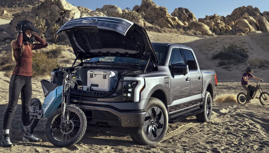 The 2023 Ford F-150 Lightning camping with the frunk open