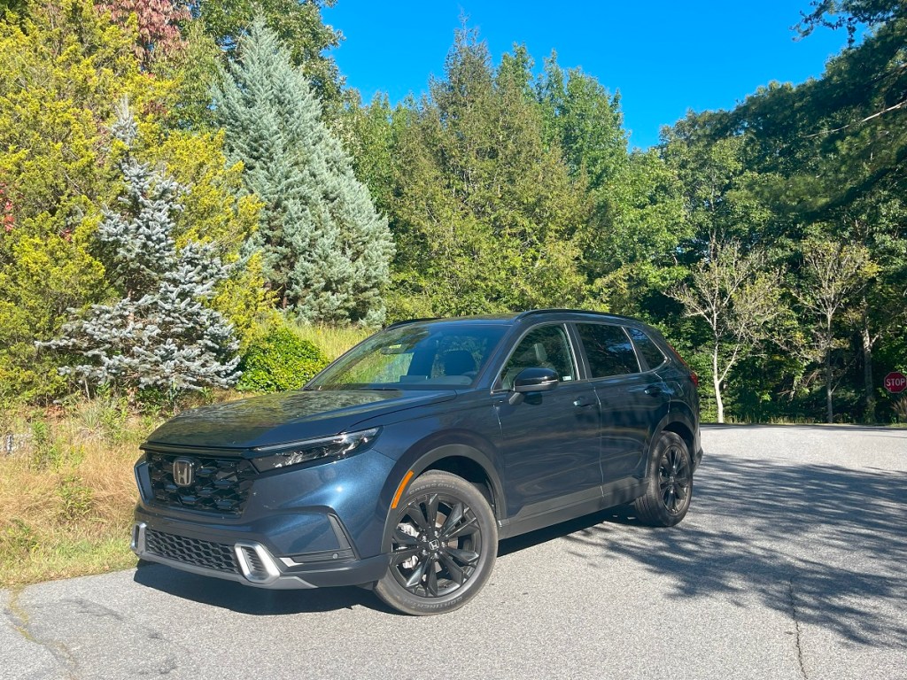 The 2023 Honda CR-V Hybrid parked near trees 