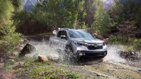 The 2023 Honda Ridgeline off-roading in mud