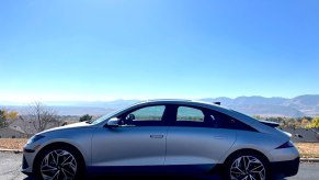 A side view of the 2023 Hyundai Ioniq 6 with a valley back drop