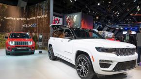 White Jeep Cherokee on display at Brussels Expo. The Jeep Cherokee's price turns many off from buying.