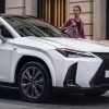 A white 2023 Lexus UX 250h parked on the street. The 2023 Lexus UX resale value is pretty high.