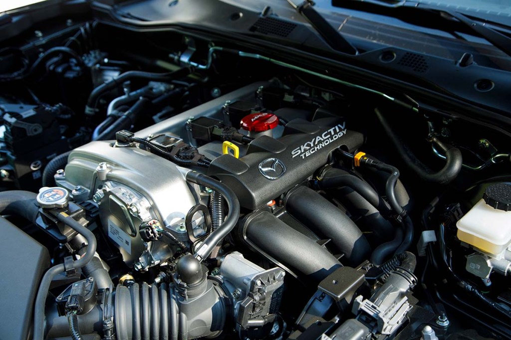 Detailed photo showing the 2.0-liter four-cylinder VVT Skyactiv engine under the hood of an ND mazda Miata, which spans from the model years 2019 to at least 2023