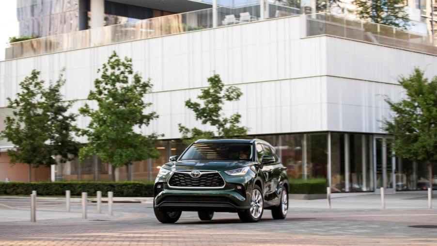 The front of a green 2023 Toyota Highlander. Toyota sales for the Highlander are worse than the Corolla.