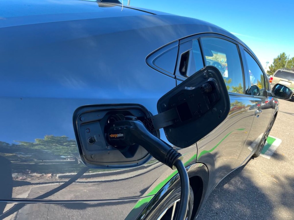 The charger plugged into the 2023 Toyota Prius Prime