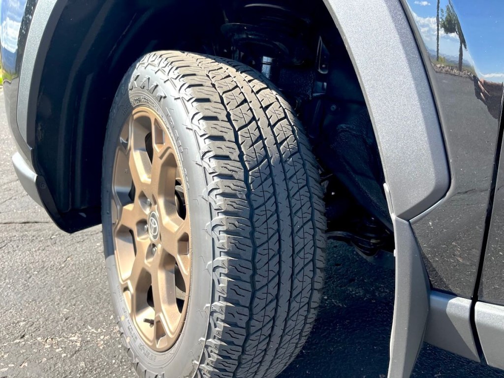 The all-terrain tire and bronze wheel on the 2023 Toyota RAV4 Woodland