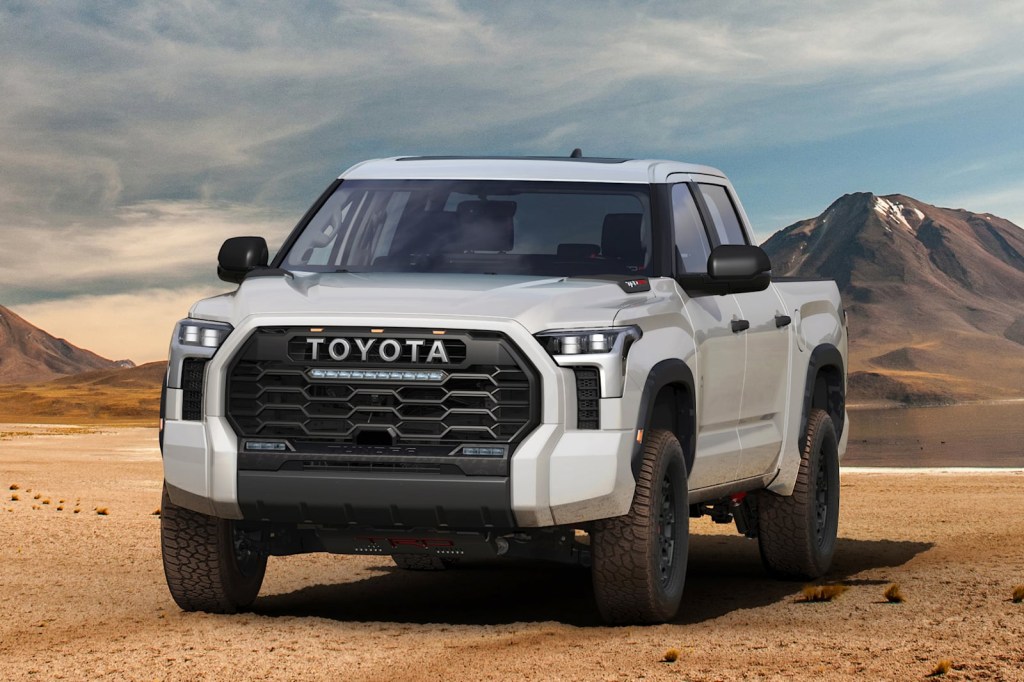A white Toyota Tundra TRD Pro front view with mountains in the background. 