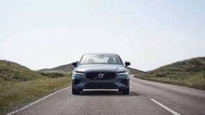 A front-facing 2023 Volvo S60 Recharge T8 PHEV compact executive car in Thunder Grey