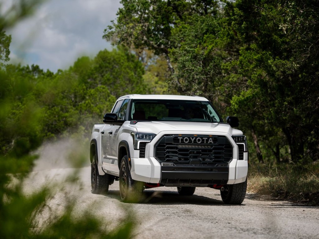 The 2023 Toyota Tundra off-roading on a dirt road