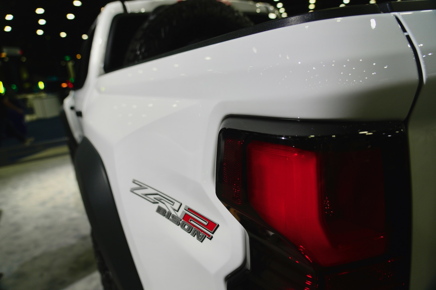 The ZR2 Bison sticker on the bed of a white Chevrolet Colorado midsize pickup truck.