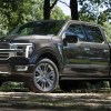 The 2024 Ford F-150 off-roading in the woods