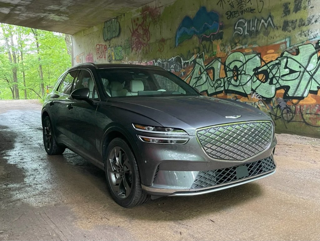 The 2024 Genesis Electrified GV70 parked by grafitti