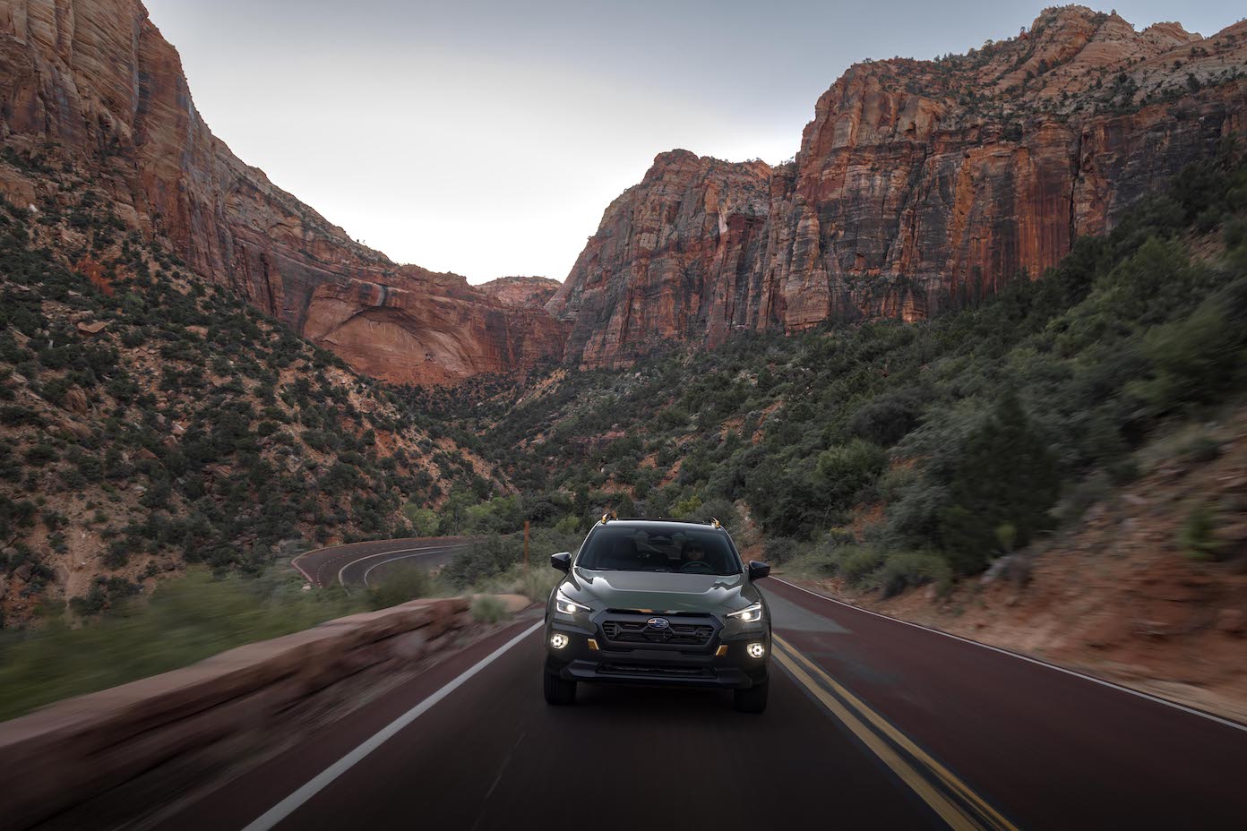 The most popular Subaru SUV, the Subaru Crosstrek, driving in a canyon.