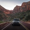 The most popular Subaru SUV, the Subaru Crosstrek, driving in a canyon.