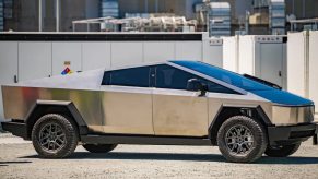 Side view of the 2024 Tesla Cybertruck electric pickup truck parked at the factory.