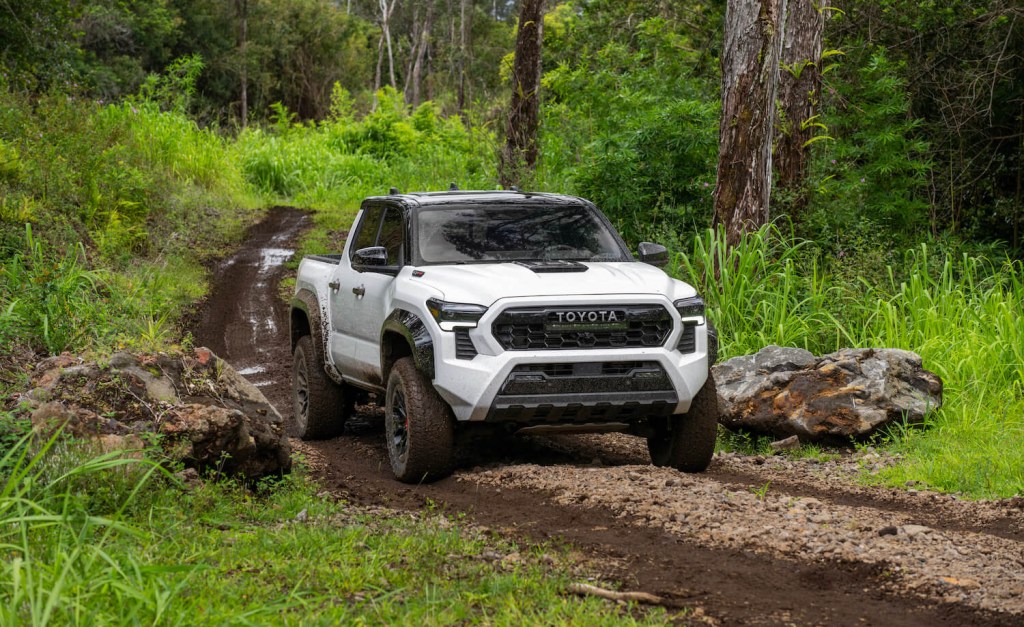 White Toyota Tacoma TRD Pro pickup truck off-roading in Hawaii
