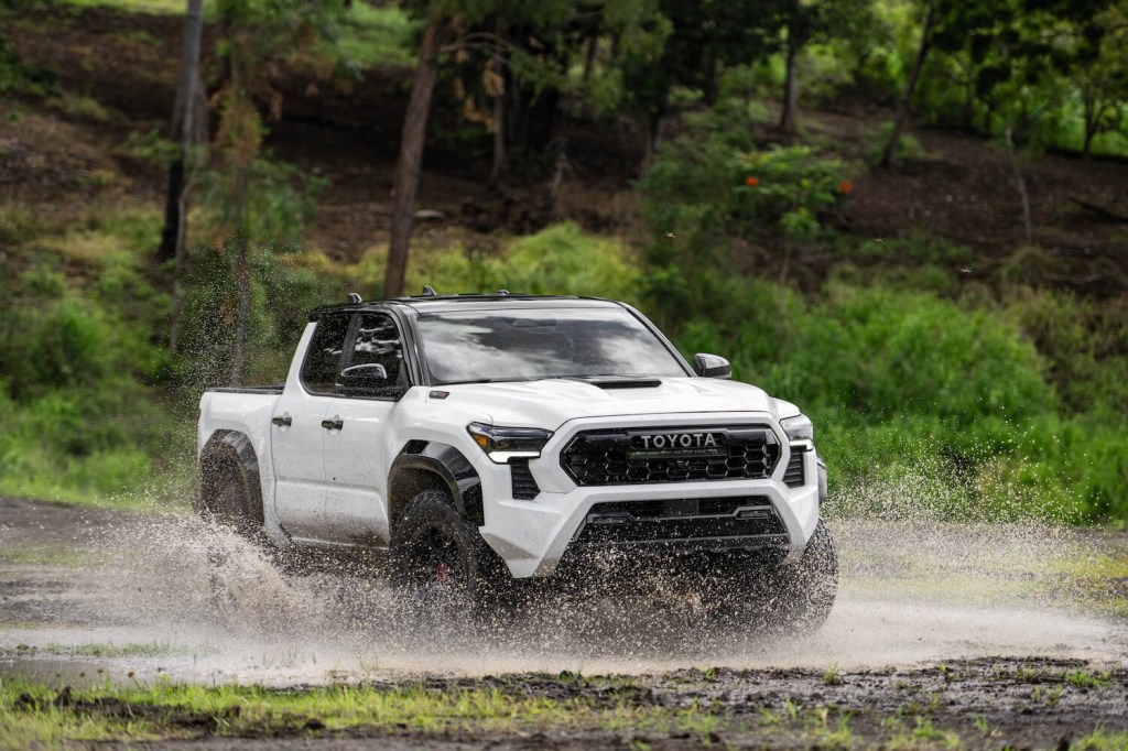 White Toyota Tacoma TRD Pro pickup truck off-roading in Hawaii