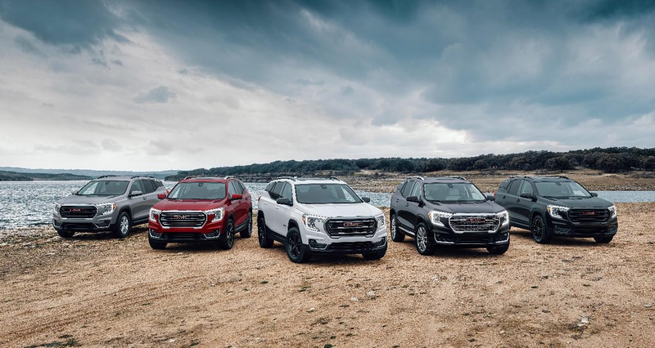 A lineup of different 2024 GMC Terrain SUVs.