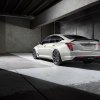 The new 2024 Cadillac CT5 in white against a gray display.