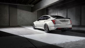 The new 2024 Cadillac CT5 in white against a gray display.