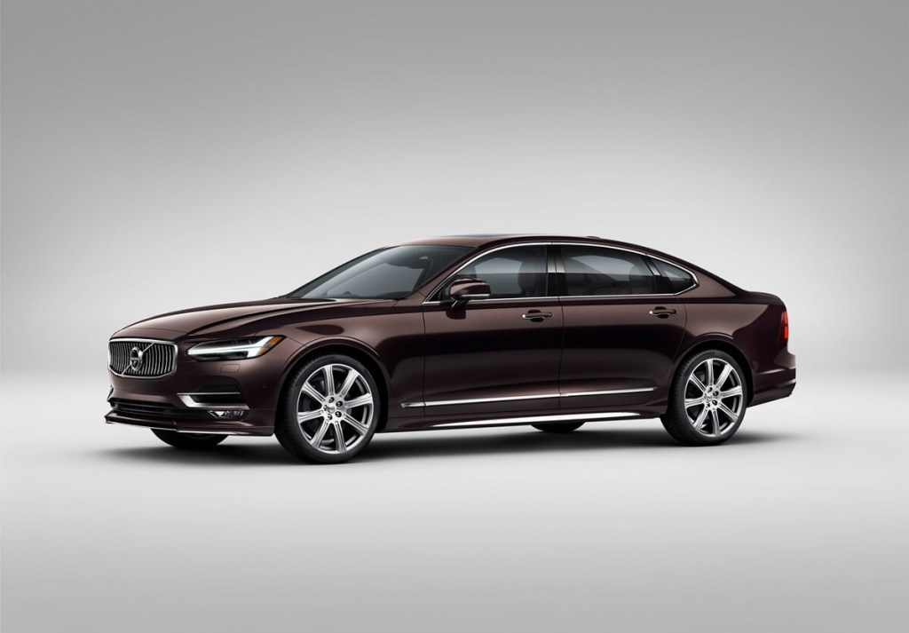 A maroon 2020 Volvo S90 shows off its side profile in a photo shoot. 
