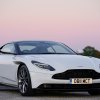 A white Aston Martin DB11, like Nathan Shelley's in 'Ted Lasso,' sits under a sunset.