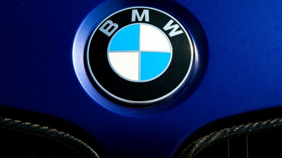 The BMW company crest on the hood of a blue model at the Polish Aviation Museum