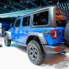 A blue Jeep Wrangler 4xe on display.