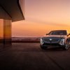 A dark Cadillac Lyriq parked in front of a window at twilight. Cadillac Lyriq sales are finally picking up.