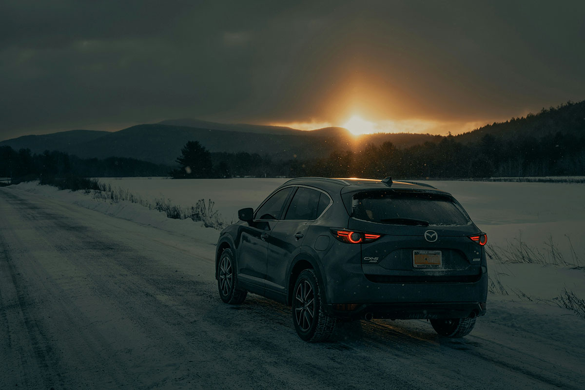 Car facing the rising and/or setting sun in the wniter