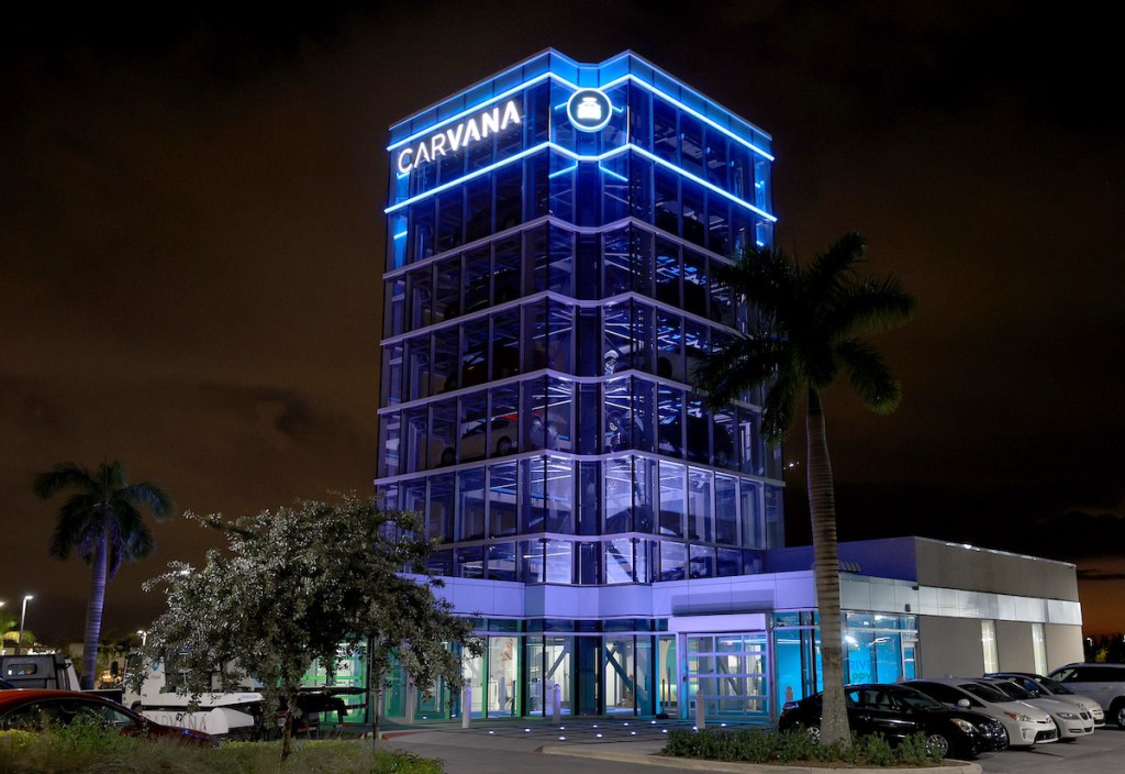 Carvana tower lit up at night. 