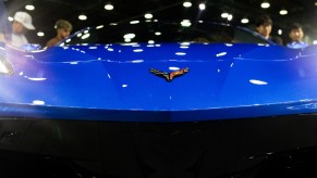 The badge of a blue 2024 Chevrolet Corvette Stingray sports car during the 2023 North American International Auto Show. The Corvette's price is a big selling point.