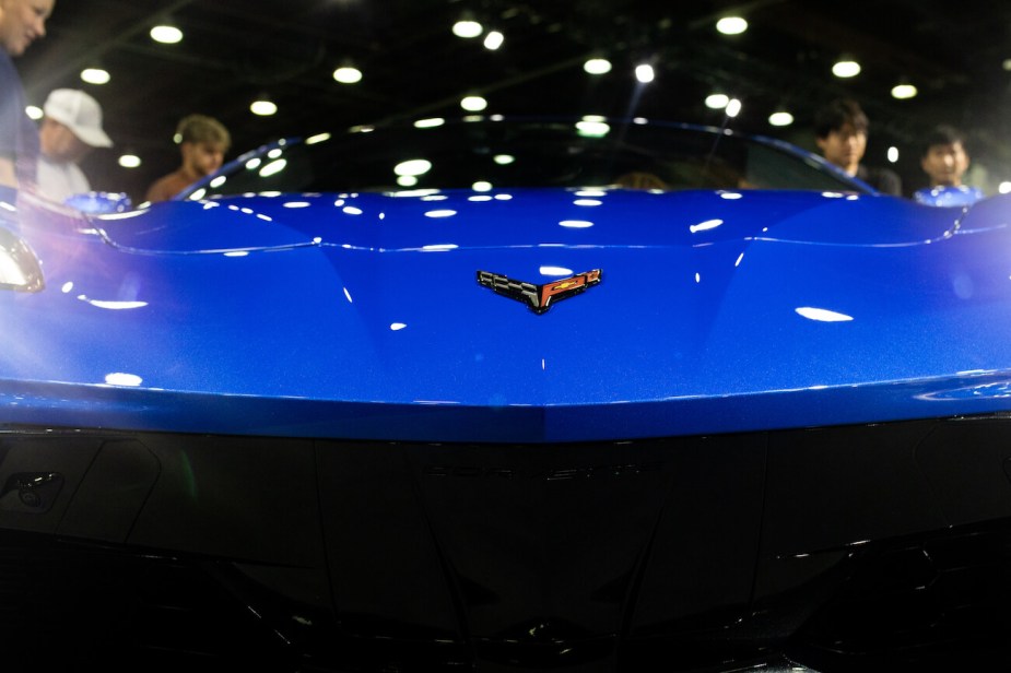 The badge of a blue 2024 Chevrolet Corvette Stingray sports car during the 2023 North American International Auto Show. The Corvette's price is a big selling point.