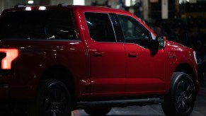The rear view of a Ford F-150 Lightning at the unveil event. The Ford F-150's price is leading to outrageous monthly payments.