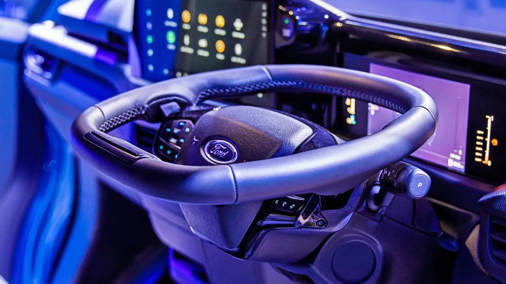 Ford e-transit fold flat steering wheel folded into the desk position.