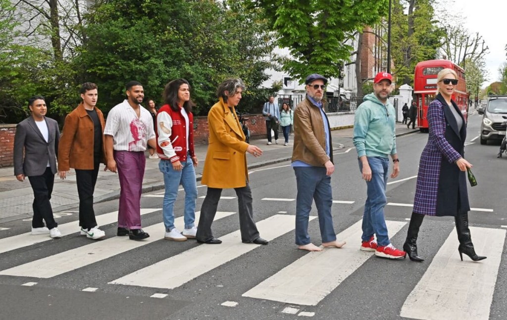 The cast of Ted Lasso crosses a street in London to pay homage to the Beatles. 