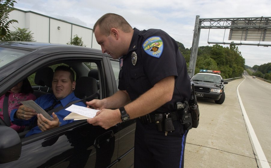 Issuing a speeding ticket through driver's window