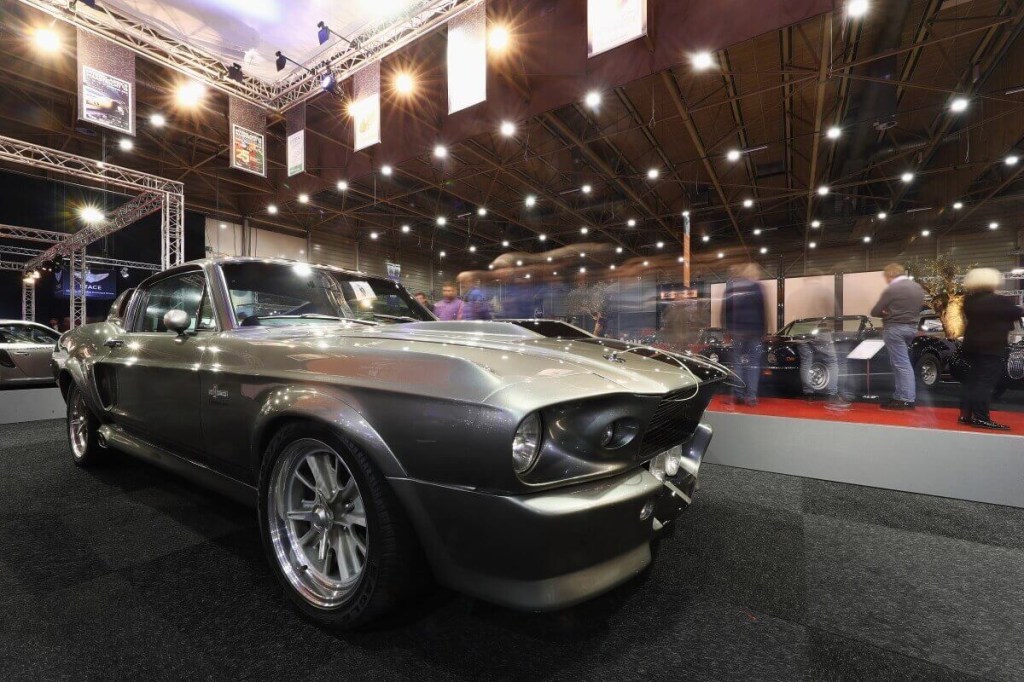 The Eleanor Mustang from Gone in 60 Seconds shows off its performance car skirts and dimensions at a car show.