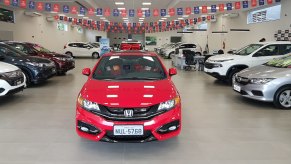 A Honda car dealership featuring a mix of new and used Honda models