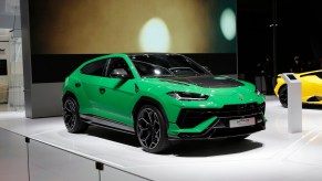 A green Lamborghini Urus at the 20th Shanghai International Automobile Industry Exhibition. Many wonder how much is a Lamborghini Urus in 2023.