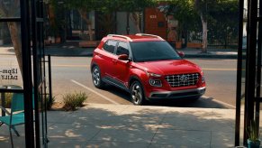 A red 2023 Hyundai Venue subcompact SUV is parked.