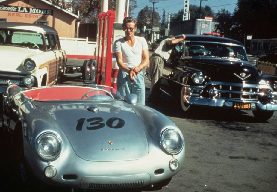 James Dean stands next to his 1955 Porsche 550 Spyder at a California gas station during his drive to Salinas, hours before his death.