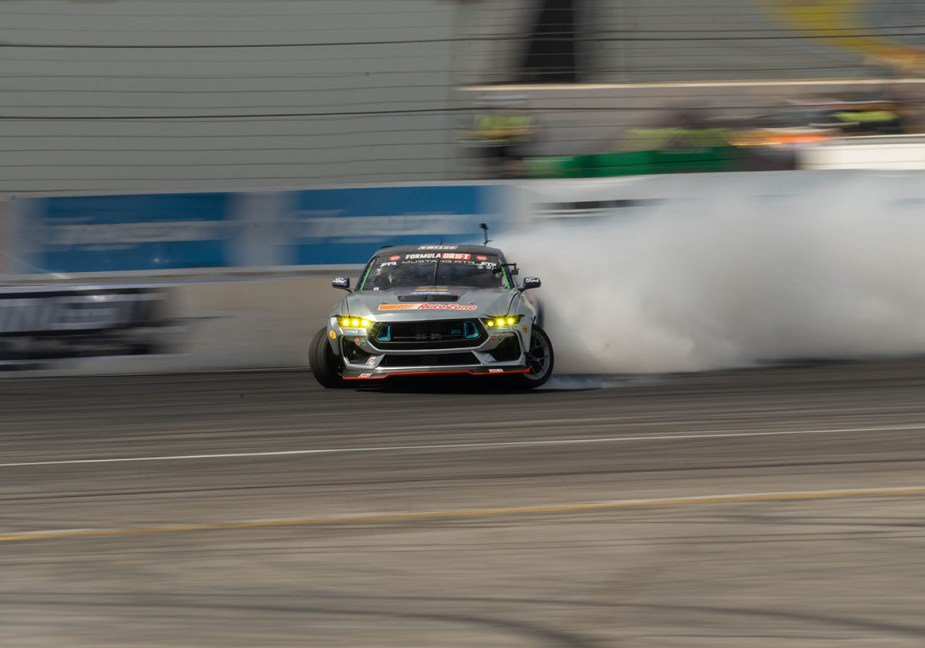 James Deane drifting his righ-hand drive RTR Spec 5 FD formula drift cars at Irwindale Speedway in October 2023