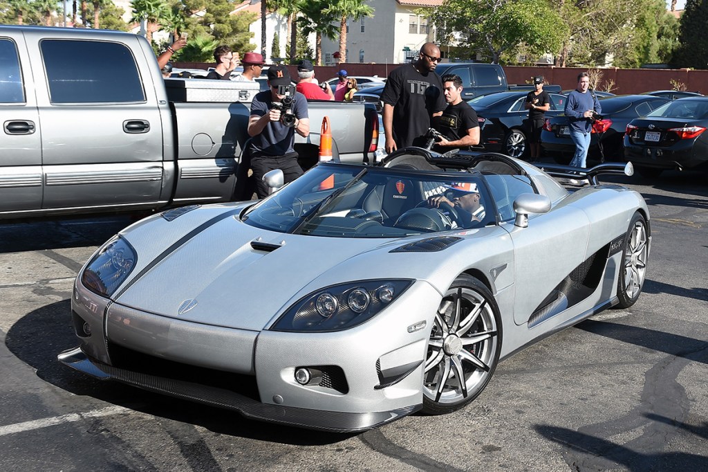 Boxer Floyd Mayweather Jr. arrives at the Mayweather Boxing Club in his new USD 4.8 million Koenigsegg CCXR Trevita car for a media workout on August 26, 2015 in Las Vegas, Nevada. Mayweather will defend his WBC/WBA welterweight titles against Andre Berto on September 12 at MGM Grand in Las Vegas