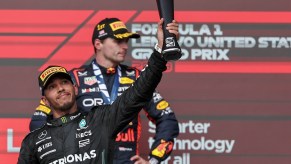 Lewis Hamilton on the podium at the 2023 United States Grand Prix at Circuit of the Americas in Austin, TX before disqualification