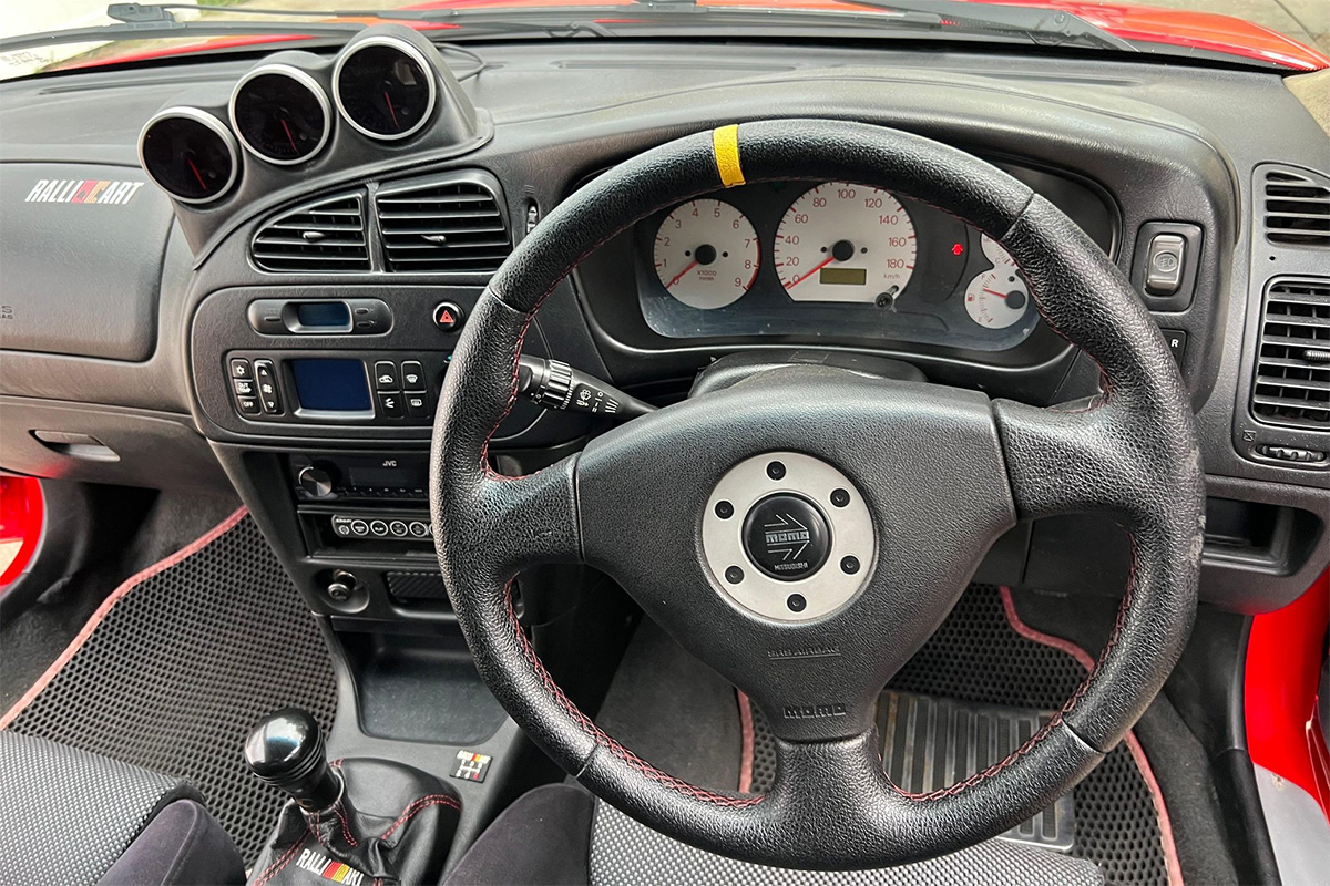 Black interior of 1996 Mitsubishi Lancer Evolution Rally homologation car