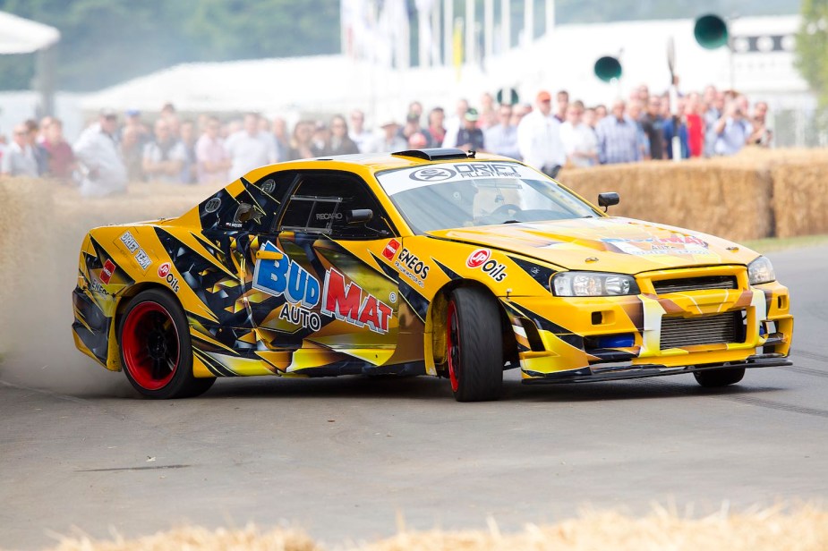 Imported Nissan Skyline car drifting at the Goodwood festival of Speed in England.