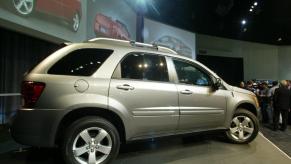 A Pontiac Torrent on display during an auto show.